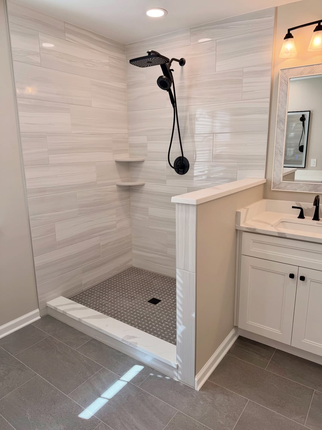 Walk-in tile shower with half wall